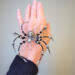 Artisan-crafted black and silver spider ornament made with glass beads, metallic accents, and elegant wirework.